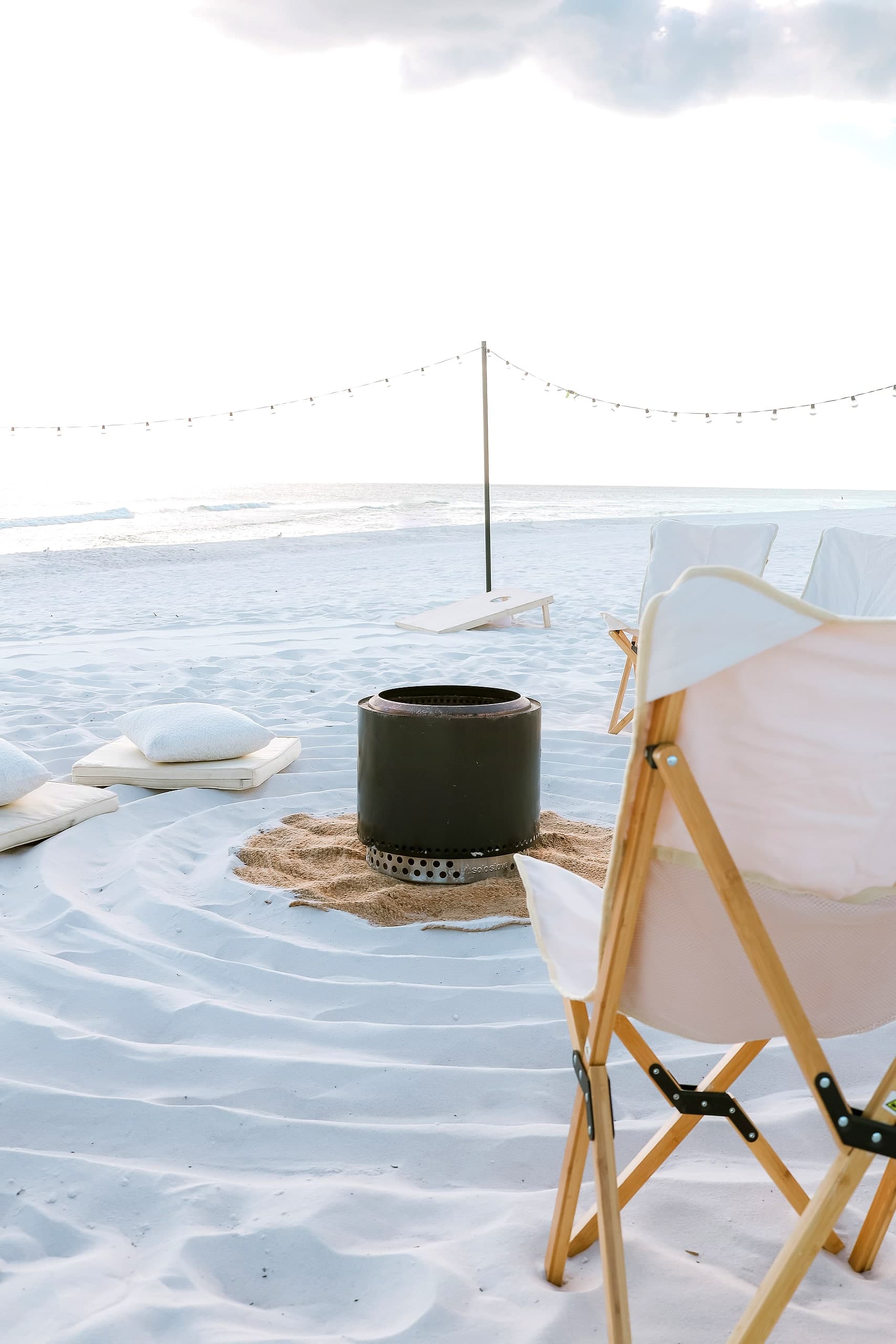 The smokeless Solo Stove fire with floor cushions and a chair